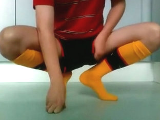 Stroking in Arsenal soccer outfit
