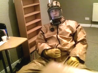 Cumming in a vintage rubber hazmat costume