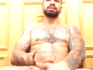 Beautiful guy Christopher with a tattooed body stroking
